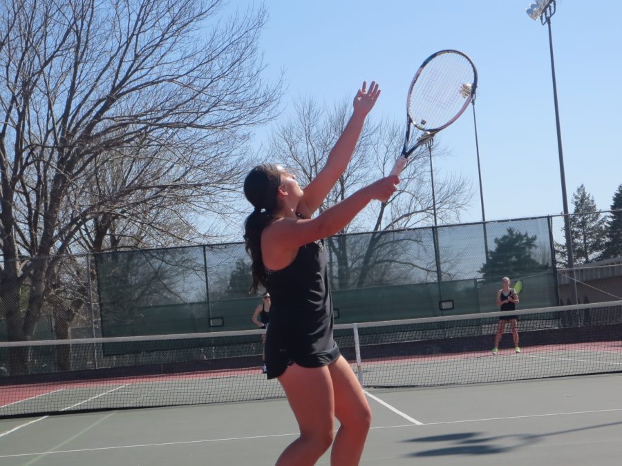 Fidan Ibrahimova (9) tosses the tennis ball up, her racquet ready to snap at any moment during her match at Woods Tennis Center on April 1st, 2015. Ibrahimova is a member of the Southeast Varsity tennis team.

Photo Cred: Ana Zeljko