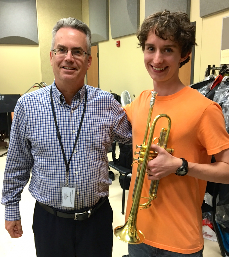 Senior Jonah Kelly (left) poses with band director Bob Krueger (right) with his trumpet that he won from the Greeley Jazz Festival last year