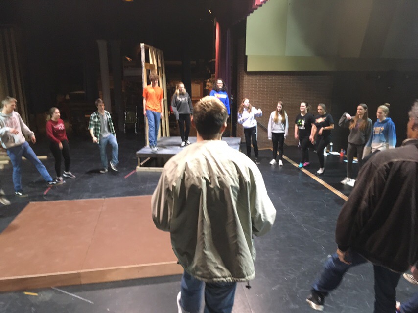The cast of Back County Crimes participates in a warm-up.
Photo Cred: Elise Anderson