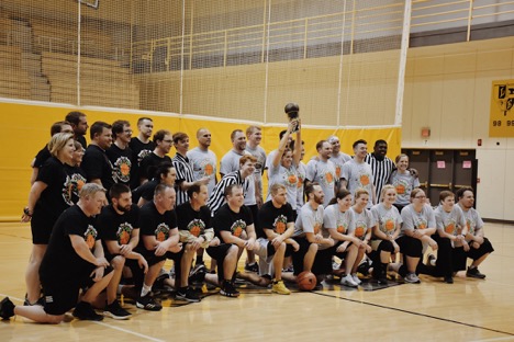 Both teams pose for pictures after the Dunks for Dollars game. The gray team (coached by Heather Leader) won the game. 