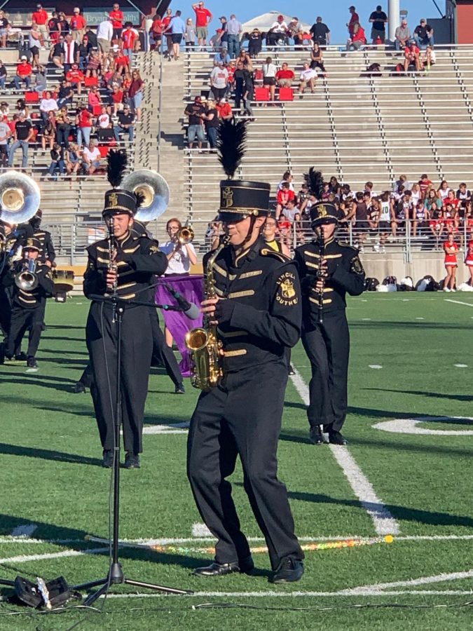 Senior Colton Harris playing his alto saxophone during his marching band solo