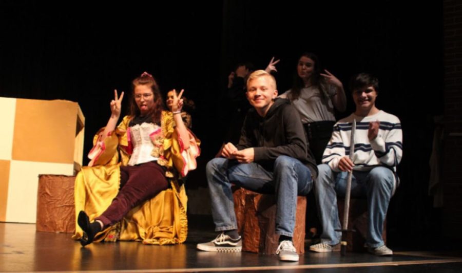 Dawson Dynek (9) on stage rehearsing Alice in Wonderland