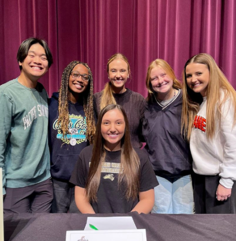 LSE Varsity Cheerleader Emily Schmid poses with other cheerleaders during the Spring Signing Day event. Schmid committed to cheer and swim and Nebraska Wesleyan University. 

Courtesy: LSE Cheer Instagram