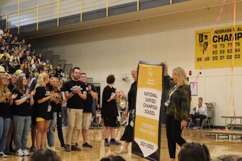 LSE Community of Learners is presented with Banner School banner at the Homecoming Pep Rally on Sept. 21, 2022.
