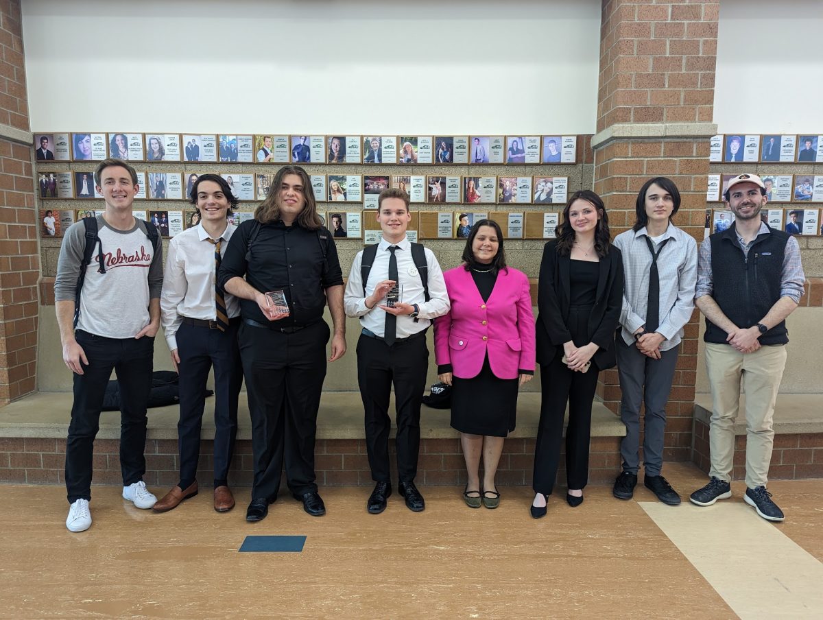 Debate Team champions pose with their awards after the 2023 Debate State Tournament. Photo Credit: Colten White