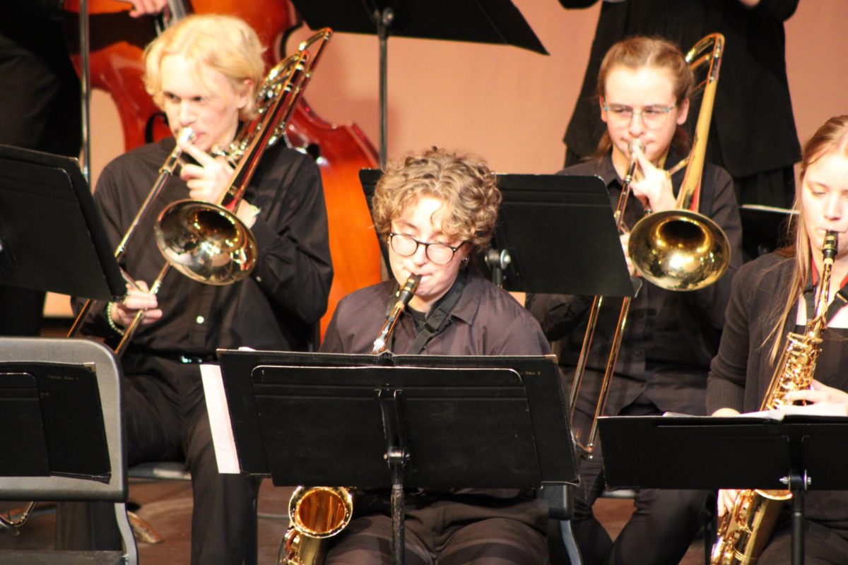 (From left to right) Garrett Amundsen (11), Olivia Eitzman (12) and Chantelle Runyan (12) play “Funkathustra”.
