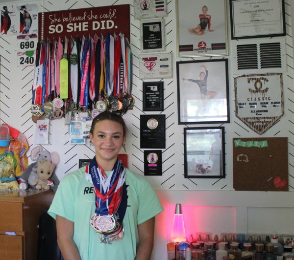 Jordan with a portion of her gymnastics medal from age 3 to 15