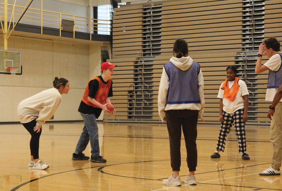 Unified P.E. members get in starting positions for a game of football
