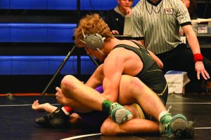 Joseph Schaffer pins one of his opponents at the Kearney Invite
Photo Credit: Gabe Huegel