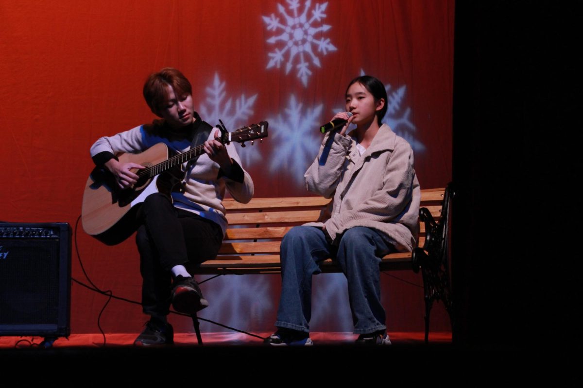 Julie Li (10) singing “Snowman” accompanied by Jayson Bach (10). 