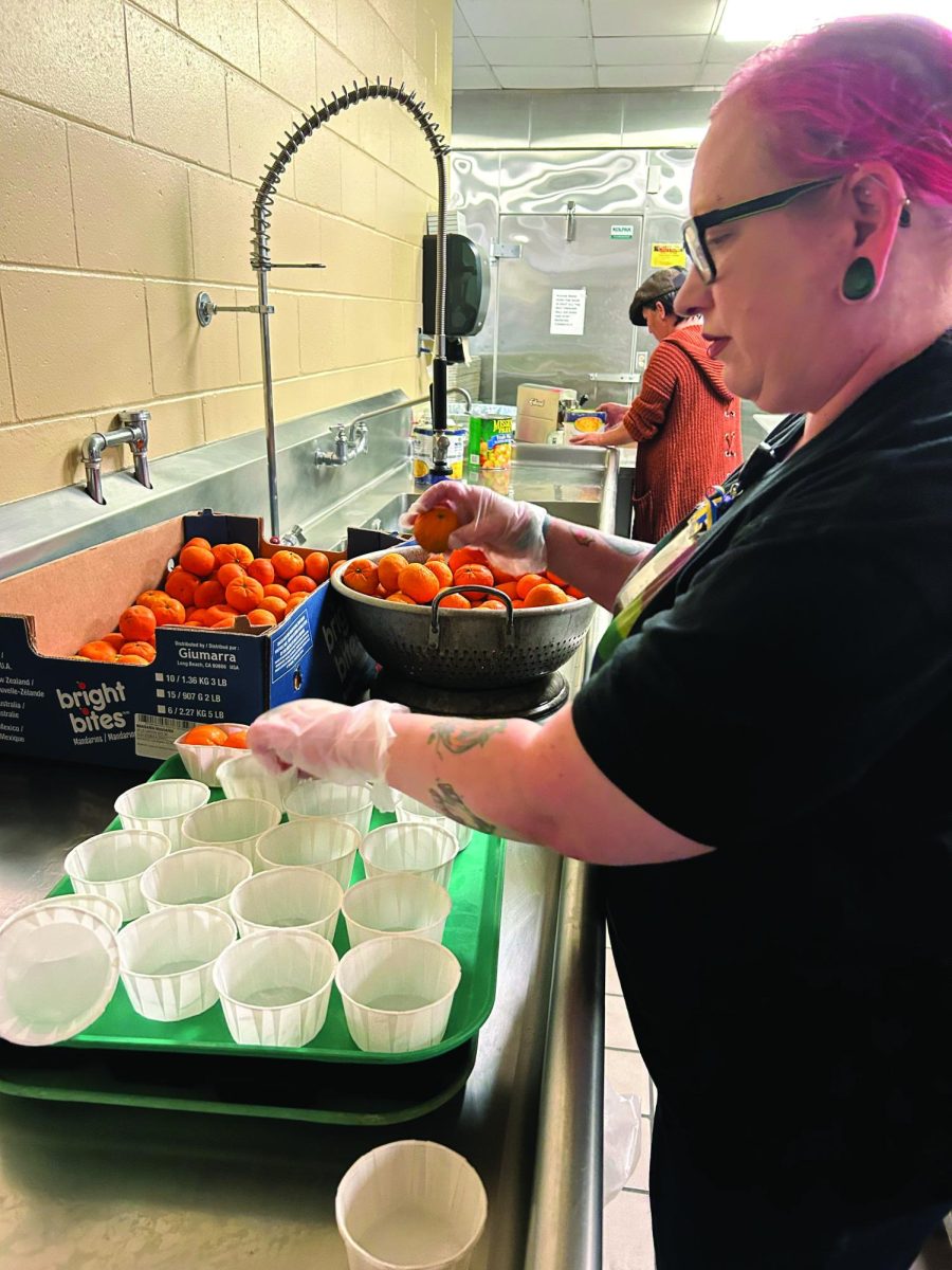 Wyman prepares oranges for lunch. 