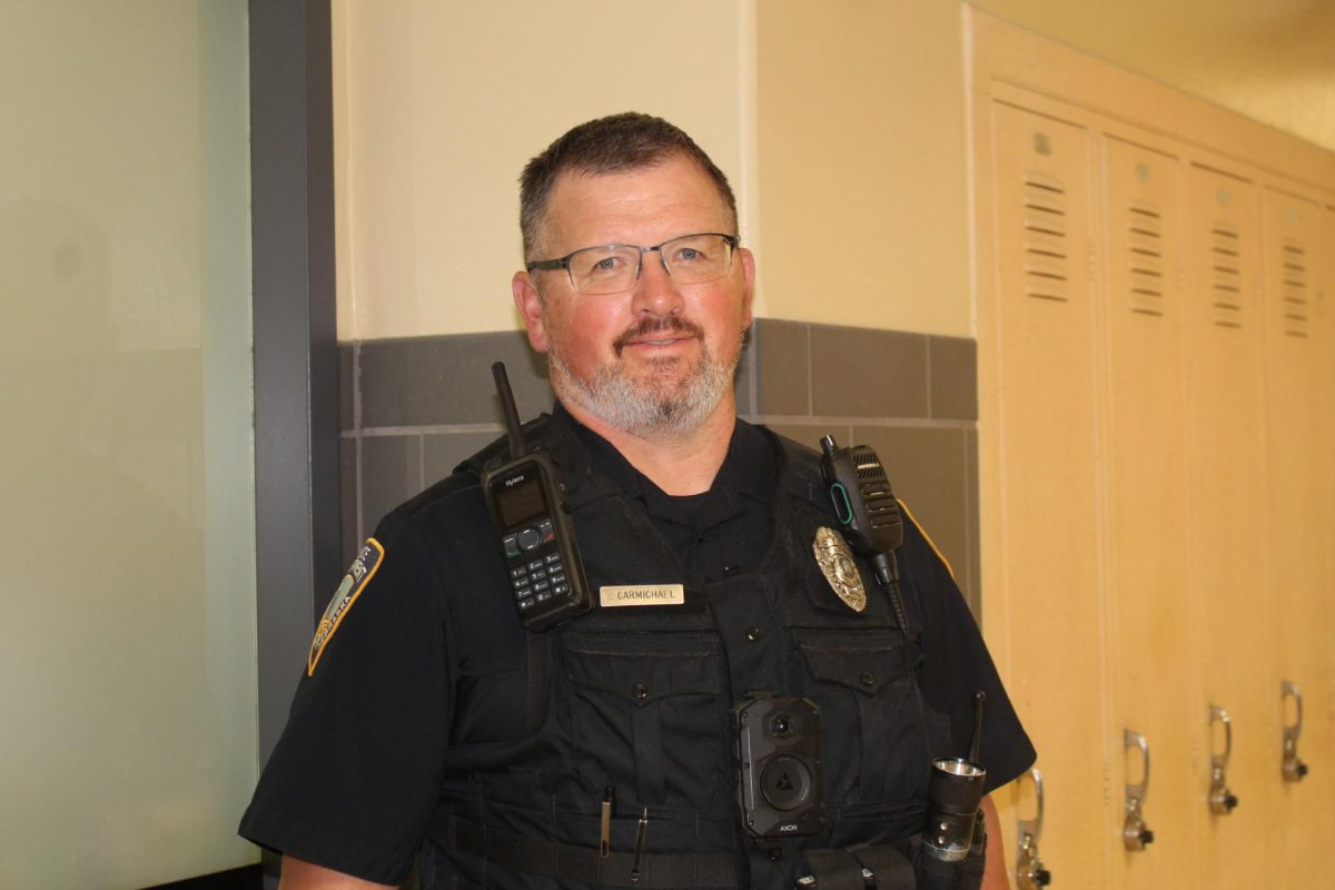 Officer Carmichael serving the halls with a friendly smile.