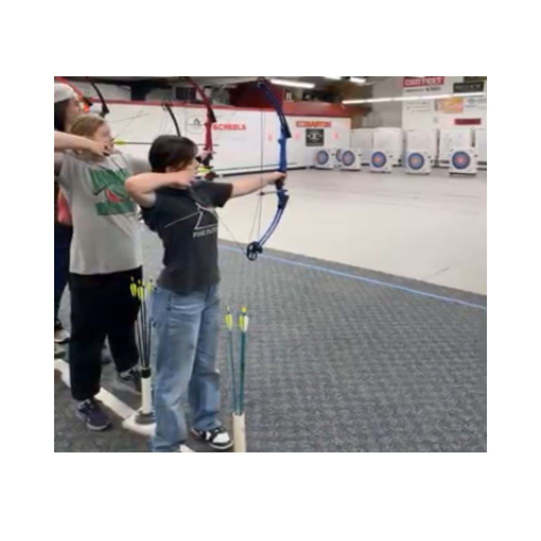 Lydia Kamazin (in black) and Melanie Elsasser (in gray) are preparing for the Nebraska State Archery torment. 